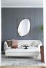 Contemporary Poppy Design Mirror with Oval Like Shape and Gold Metal Frame