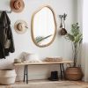 Irregular Wall Mirror with Asymmetrical Wood Frame Design and Wavy Accent Pattern