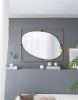 Contemporary Poppy Design Mirror with Oval Like Shape and Gold Metal Frame