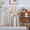 Set of 3, Handcrafted Cylindrical Metal Decorative Floor Vases with Polished & Hammered Gold Finish, and Embossed Body Pattern