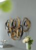 38.5” Seretha Gold Leaf Iron Wall Decor with Abstract Design and Round Geometric Shape