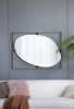 Contemporary Poppy Design Mirror with Oval Like Shape and Gold Metal Frame
