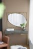 Contemporary Poppy Design Mirror with Oval Like Shape and Gold Metal Frame