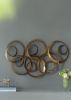 38.5” Seretha Gold Leaf Iron Wall Decor with Abstract Design and Round Geometric Shape